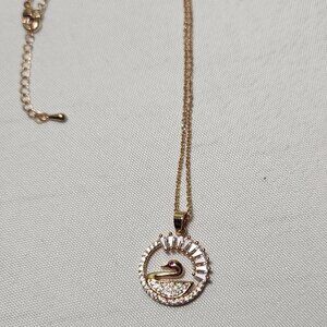 Simulated diamond rose gold tone Swan pendant with adjustable chain